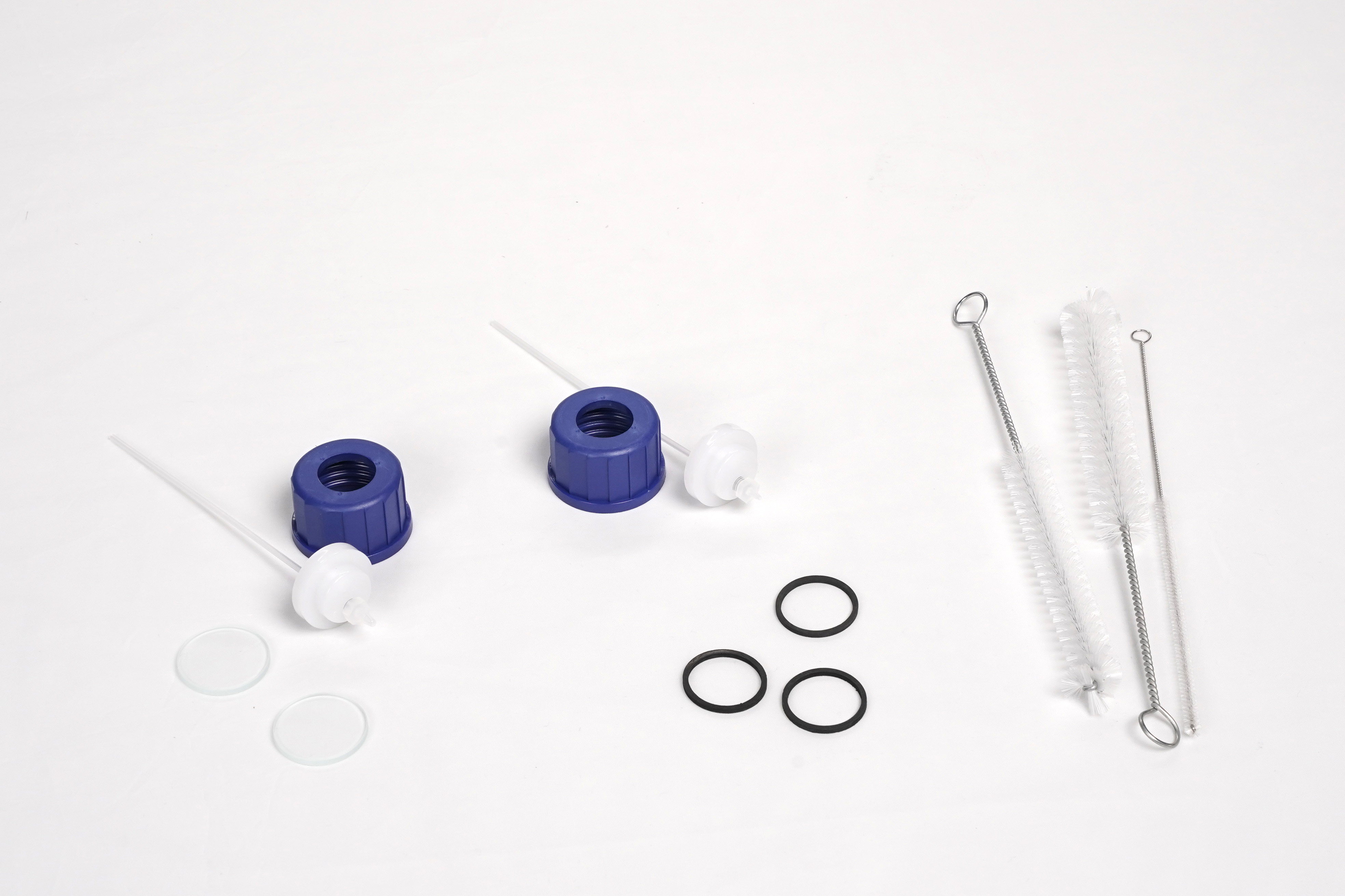 Jahres-Service-Set Professional Testomat® 808 SiO2 Jahres Service Set Professional Testomat 808 SiO₂ Komponentenbild mit Sichtgläsern, Gummidichtungen, Bürstensatz und blauen Schraubverschluss Einsätzen mit Saugrohren